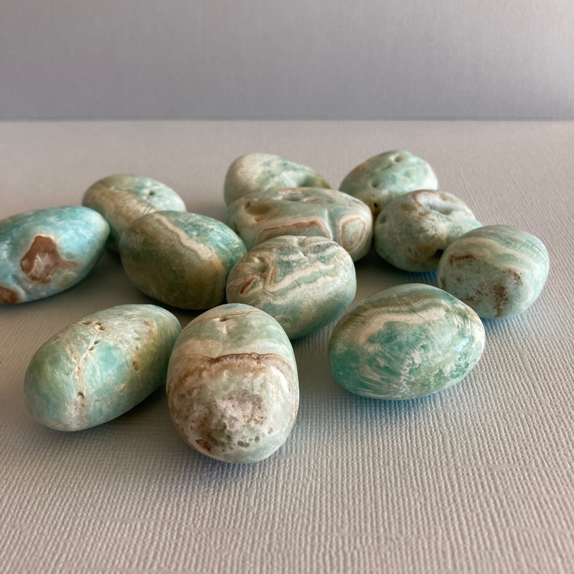 A group of Blue Aragonite tumbles