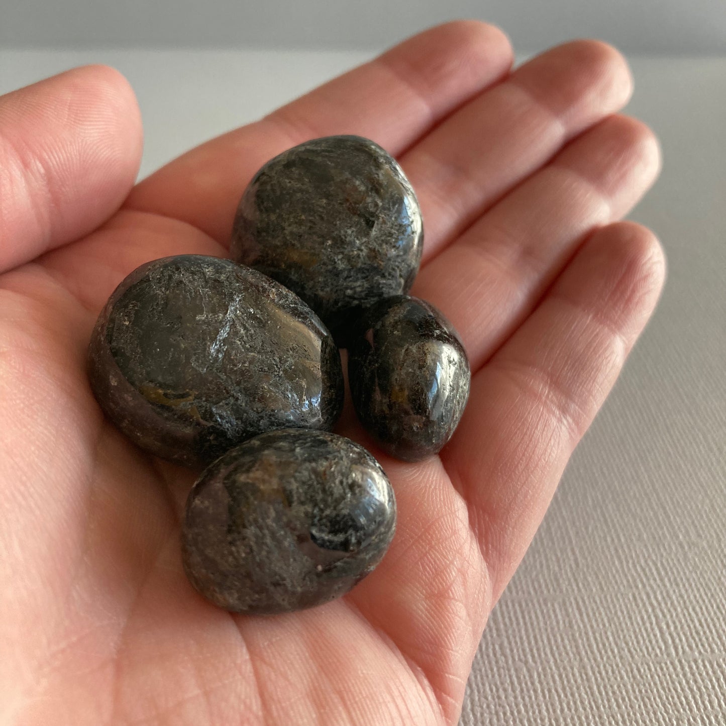 Handful of Arfvedsonite tumbles